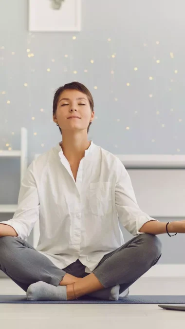 Woman Meditating in the Workplace Sitting in Front of a Laptop Practicing Stress Relief Exercises Diabetes Control