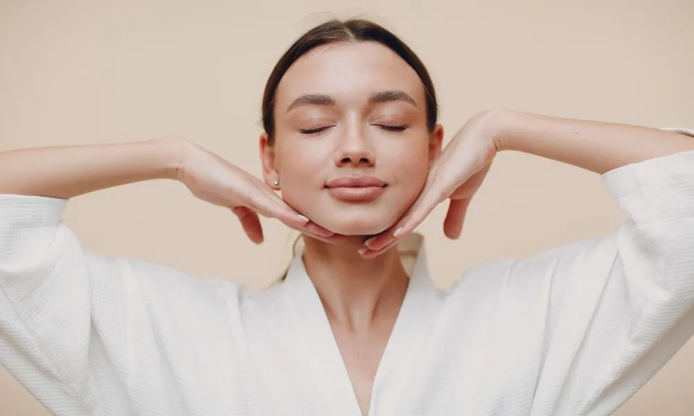 Young Woman Doing Face Building Yoga Facial Gymnastics Self Massage and Rejuvenating Exercises