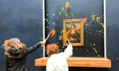 Protesters throw soup at Mona Lisa painting