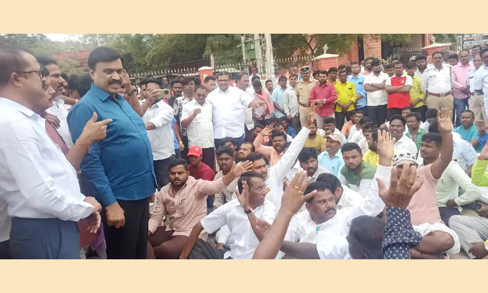 Sudden protest in gangavathi against desecration of Dr.B.R. Ambedkar statue
