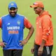 Rohit Sharma and Rahul Dravid share a joke at India's training session
