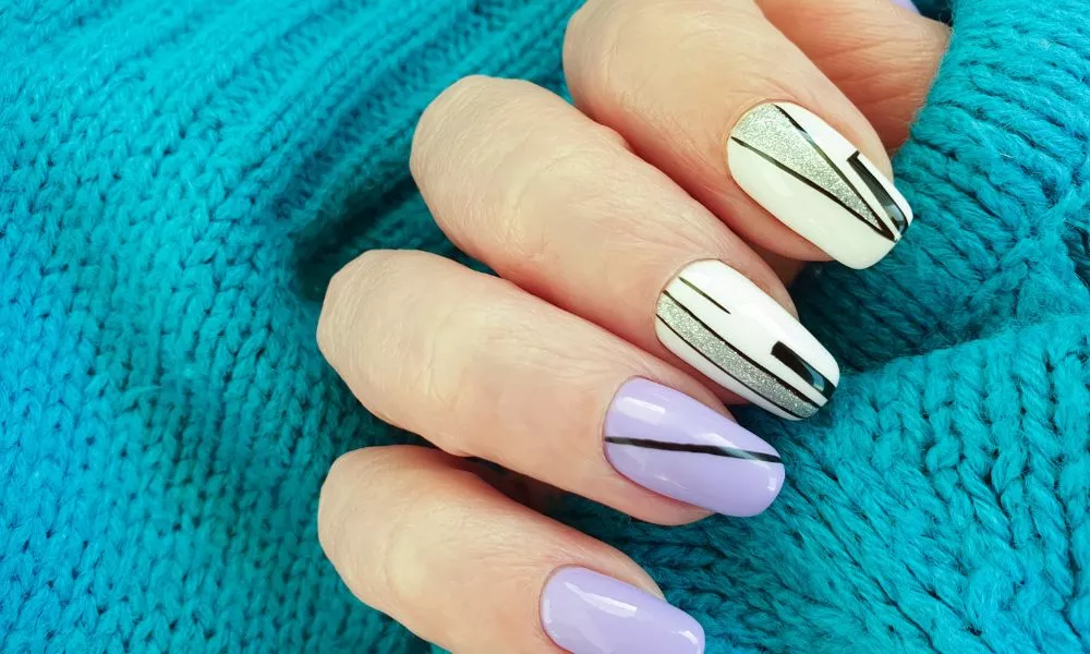 female hand nail beautiful manicure sweater