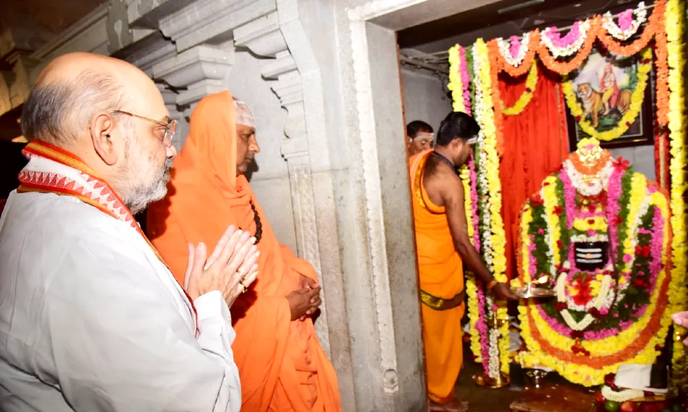 Vibhuti on Amit Shah forehead and Parvathamma Shamanur Shivashankarappa Guest House inaugurated