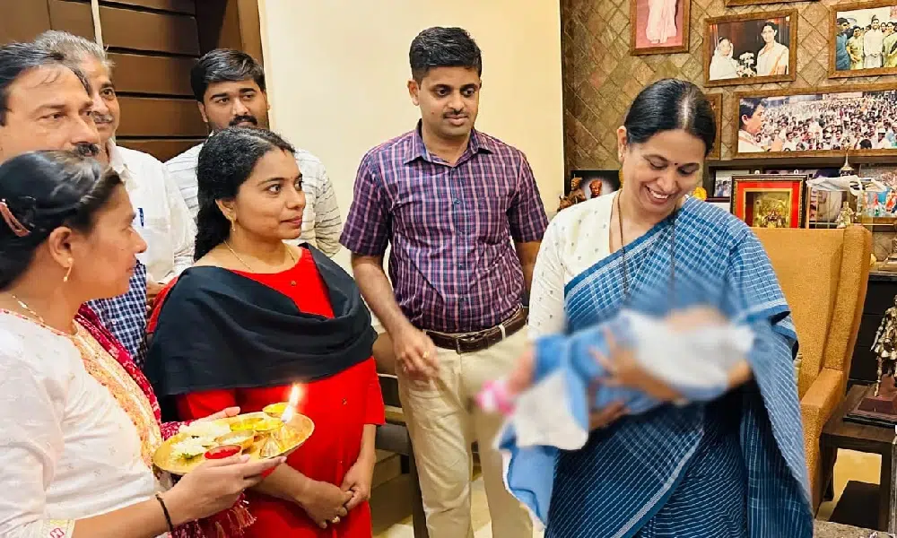 child adoption Minister Lakshmi Hebbalkar hands over baby to Kerala couple