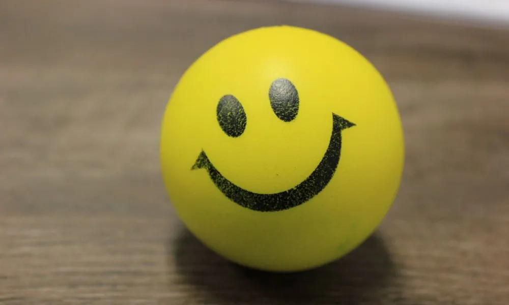 Smiley Ball on a Wooden Surface