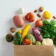 Fruits and Vegetables Spilling from Paper Bag