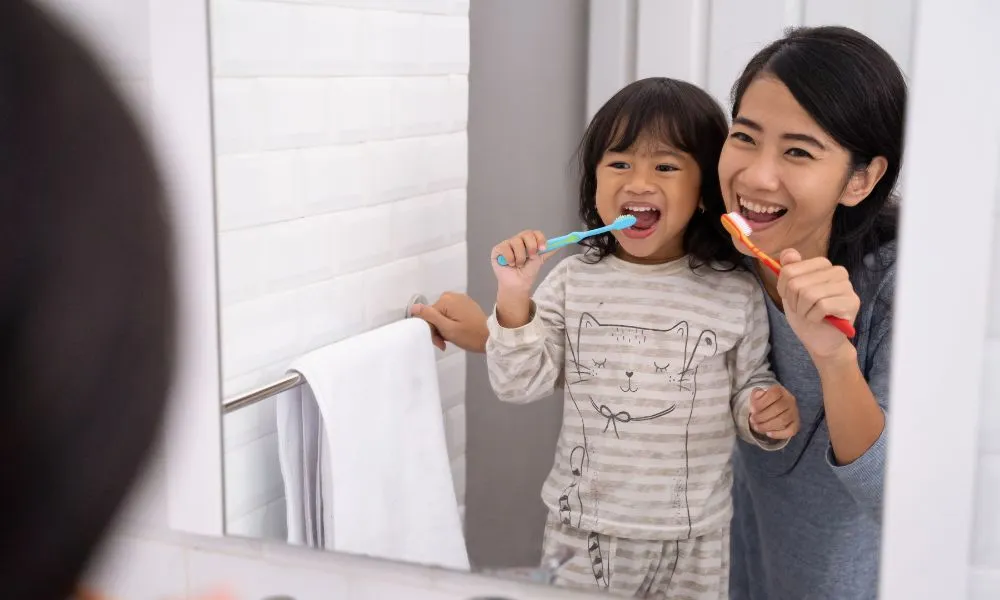 Mom and Kid Brushing Their Teeth Together