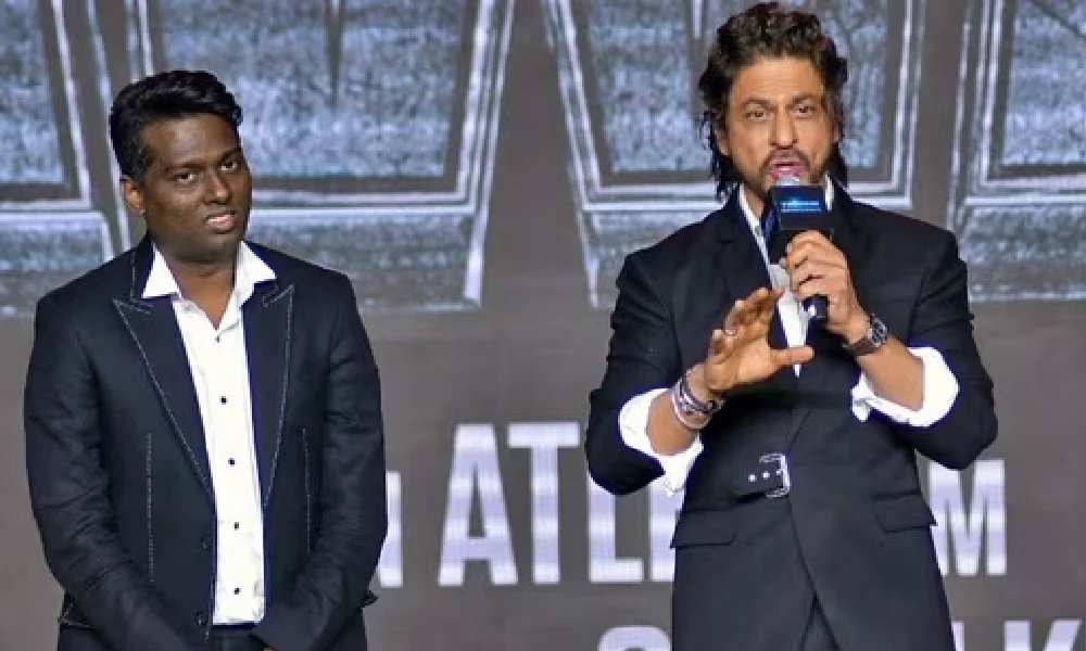 Shah Rukh Khan reacts as Atlee touches