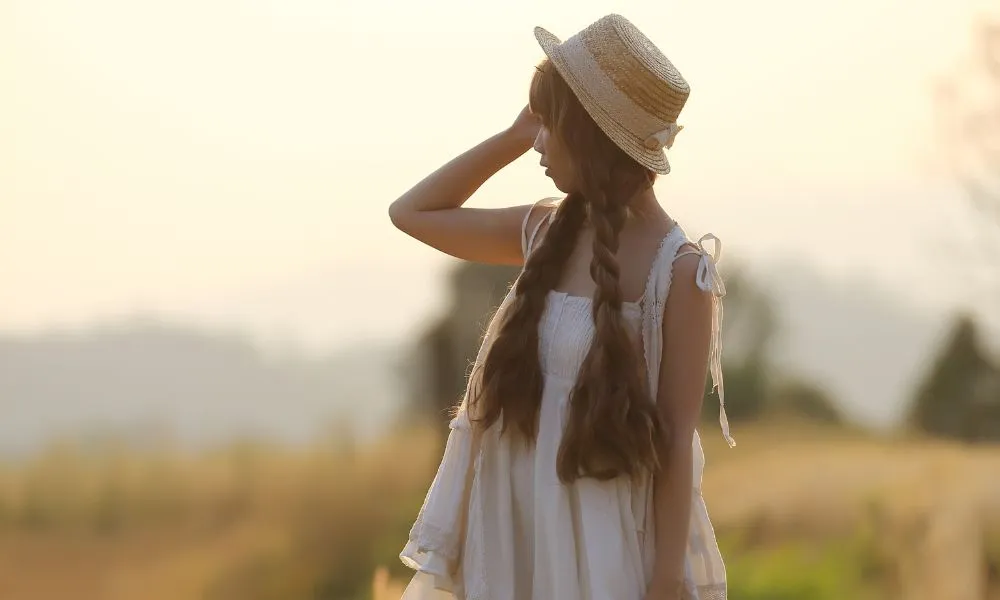 Woman in Hat on the Wheat Field