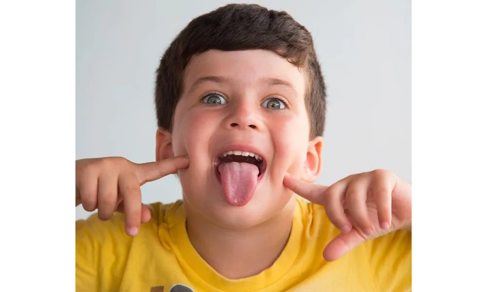 Little kid sticking out his tongue