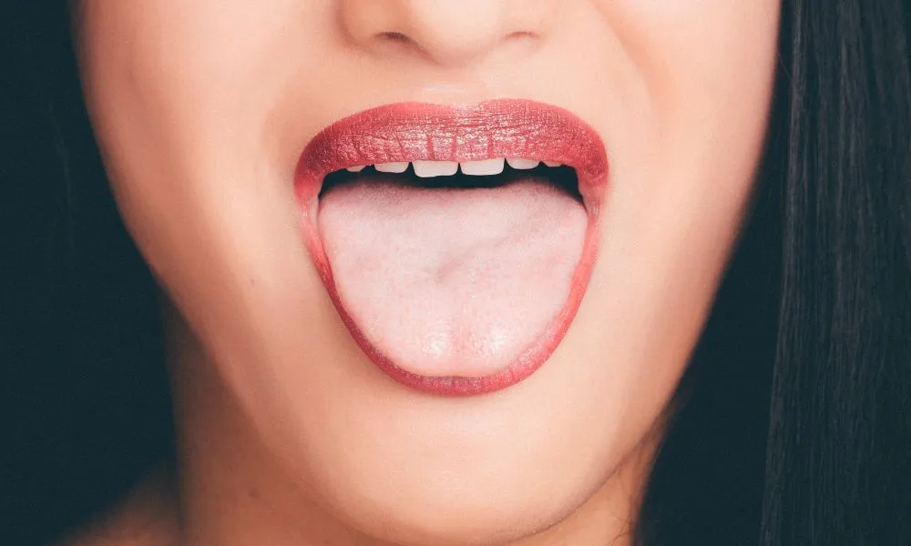 Woman With Wide Open Mouth and Tongue Out
