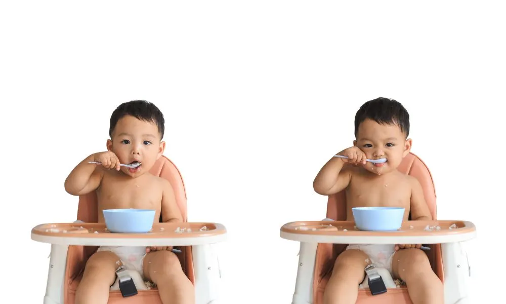 baby boy eating food by himself