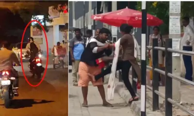 A rider standing on a bike and Young man and woman fight in road