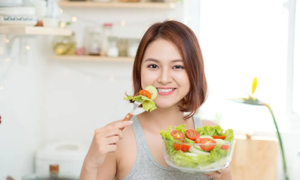 Dieting concept. Healthy Food. Beautiful Young Asian Woman