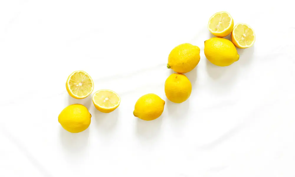 Lemons on White Marble Background