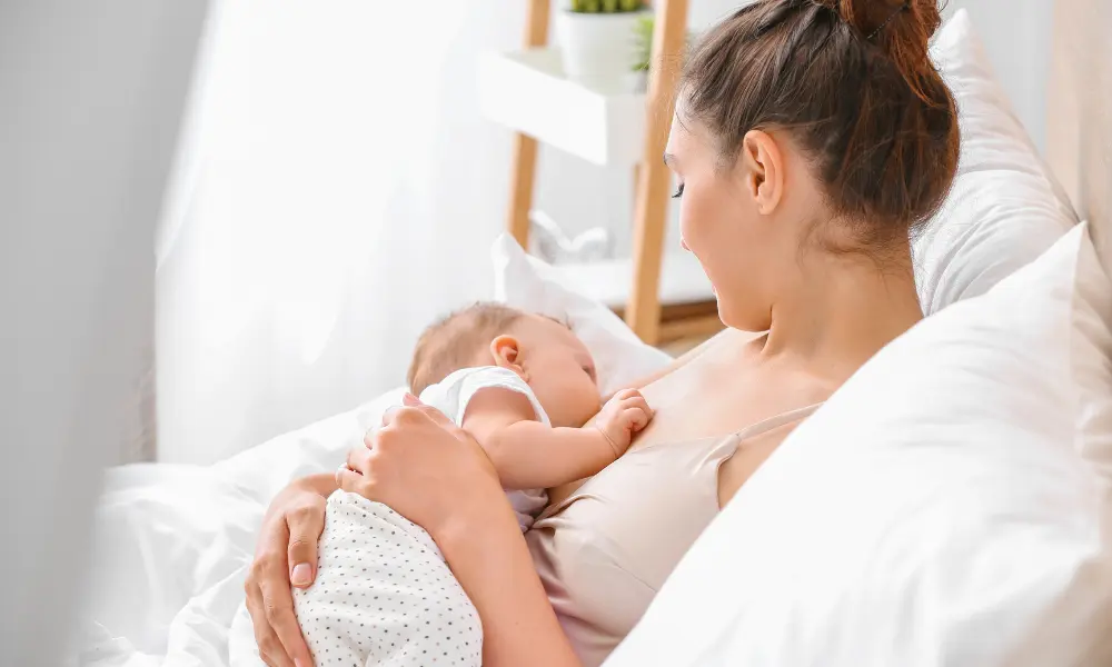 Young Woman Breastfeeding Her Baby at Home